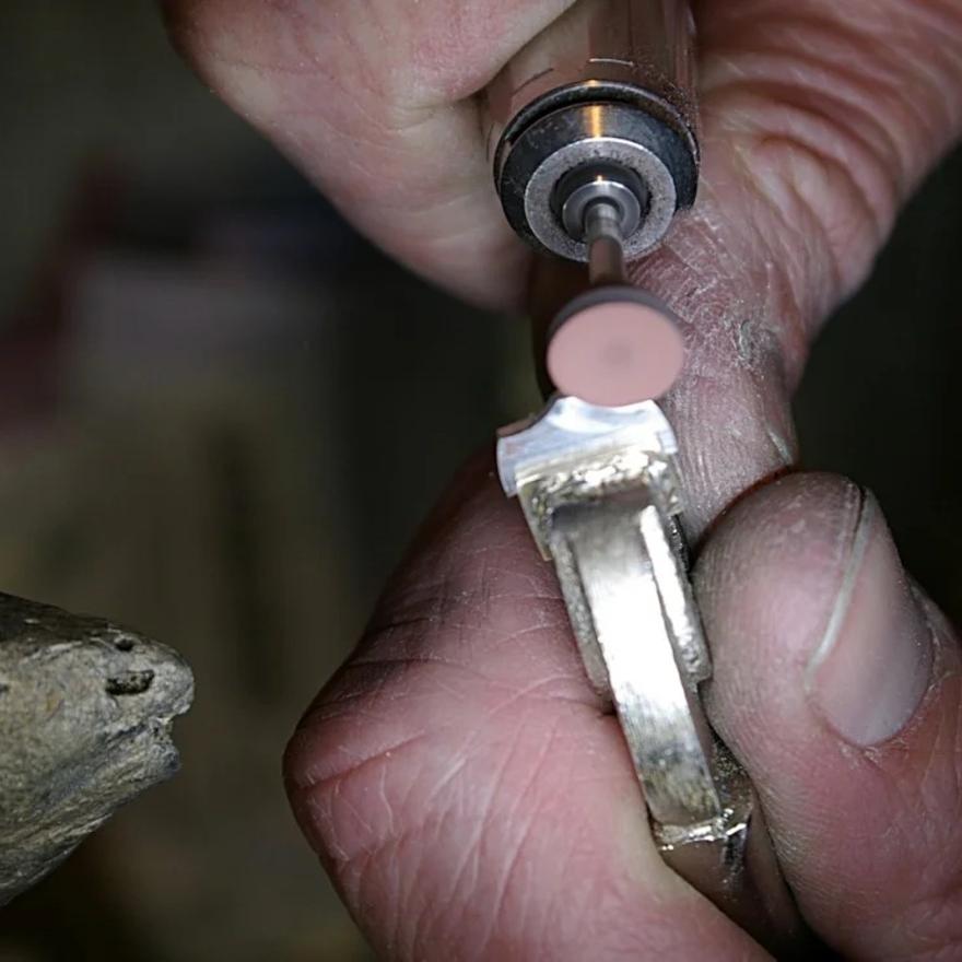 Prepolishing with rubber abrasive wheel.