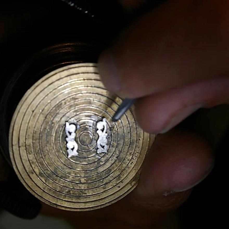 Pierced and then hand engraved and sculpted.