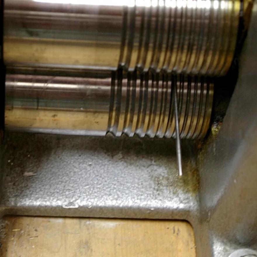 Making wire to be used in chain fabrication.