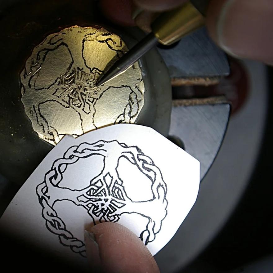 Transfering design to plate for carving.