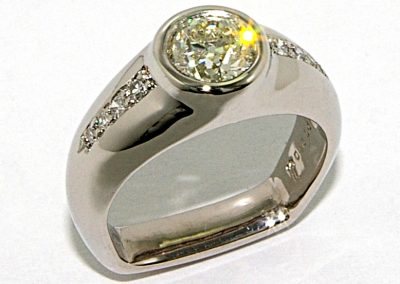 Flush set diamond engagement ring with antique cut diamond, old European cut diamond, palladium