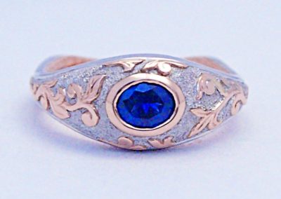 Old world Viking style, engagement ring, .60ct Montana Sapphire, hand engraved rose gold overlay, palladium