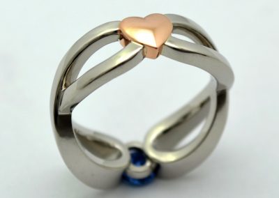 .60ct oval Yogo sapphire engagement ring, eternity symbols and heart, palladium and rose gold